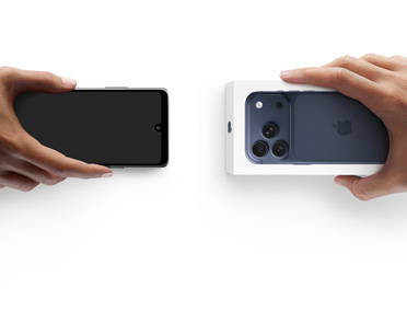 Hands exchanging phones, Android on the left without a box, on the right is a new Bulk Energy Supply  in box